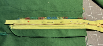 Pull the zipper to the left